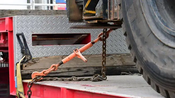 Securing cargo for safe transportation on a flatbed trailer