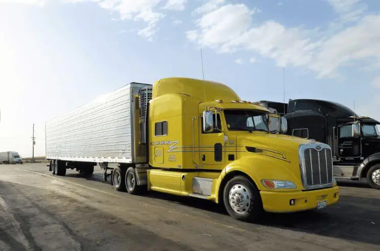 Yellow truck delivering cargo